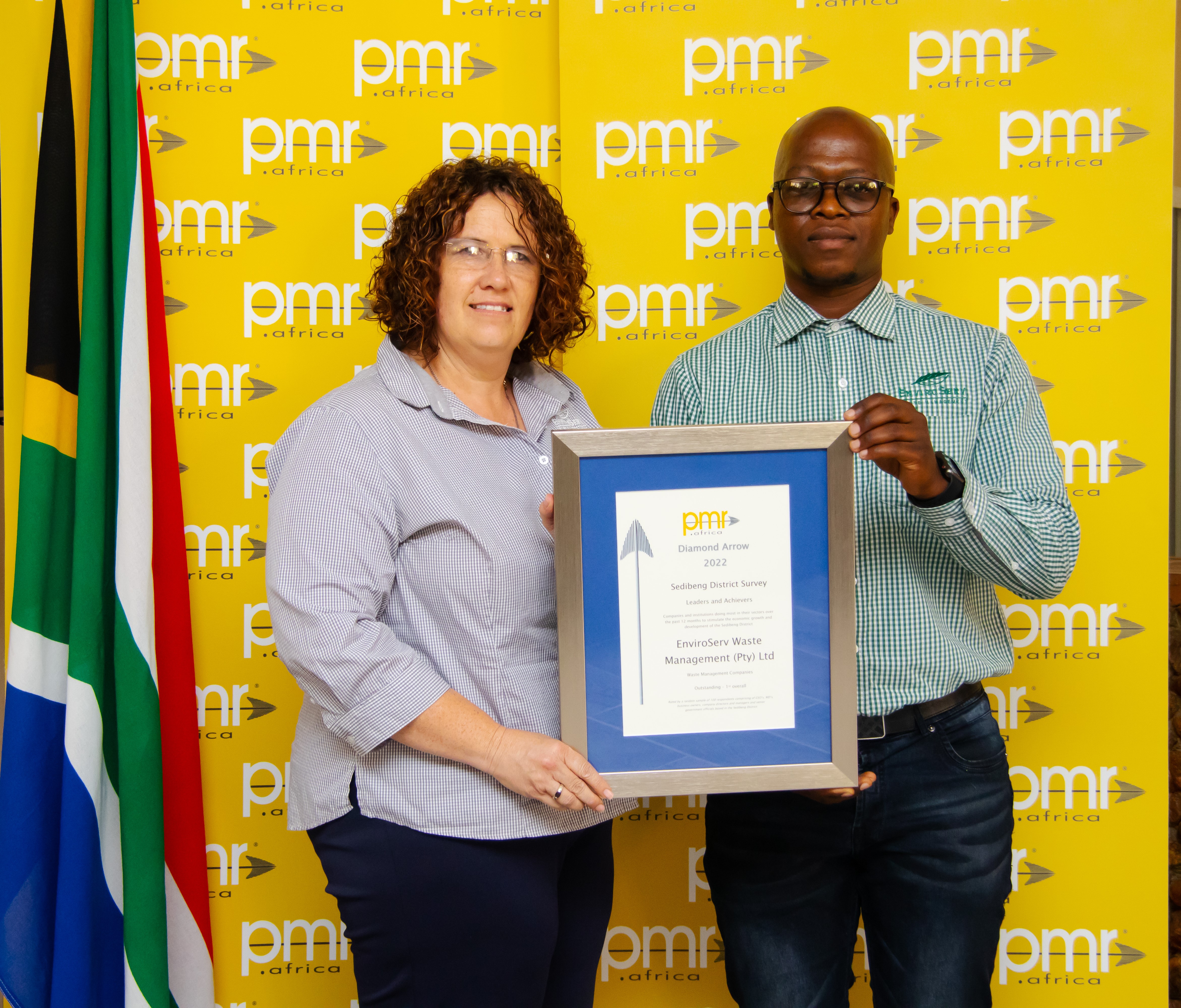 Alma Muller and Tumelo receiving the award